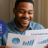 A man smiling while holding and reviewing an assessment report with charts and graphs, featuring the Dominion Holdings logo.